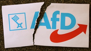 Das Logo der Bremer AfD mit einem Riss darin. (Symbolfoto)