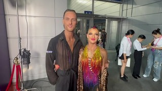 Das Tanzpaar Daniel Dingis und Alessia Gigli vom Grün-Gold-Club Bremen sind zu sehen.