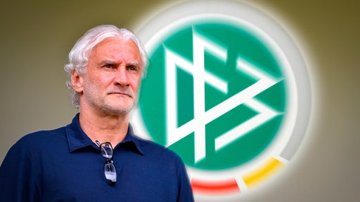 DFB-Interimstrainer Rudi Völler blickt ernst an der Kamera vorbei.