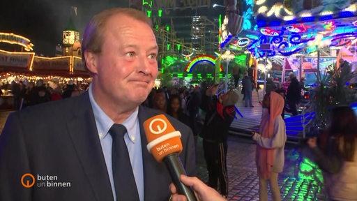 Rudolf Robrahn vom Schaustellerverband im Interview mit buten un binnen auf dem Ischa Freimarkt.